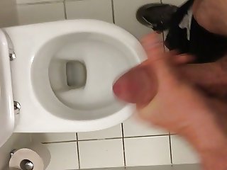 Masturbating in public toilet